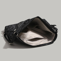 Aesthetic shoulder bag in black with a sleek design and front zipper & stars detail - boogzel clothing