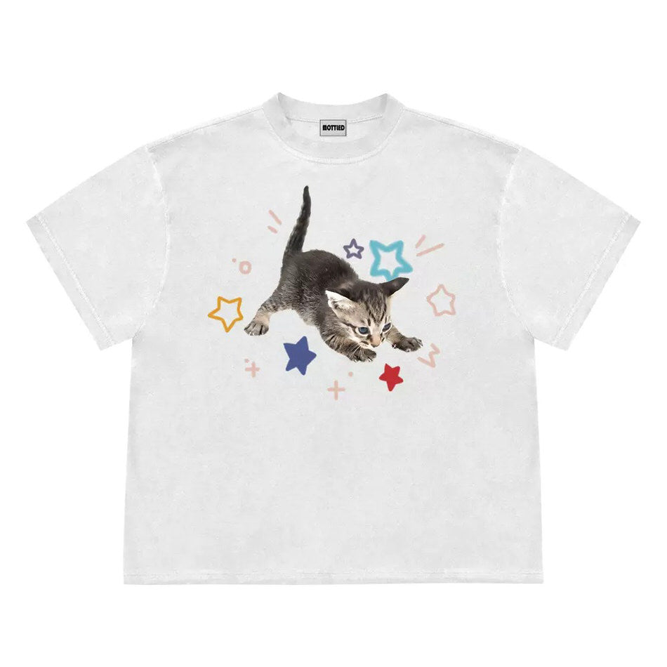 Bright t-shirt with a cute kitten graphic surrounded by colorful stars - Boogzel Clothing