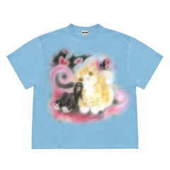 Graphic t-shirt with a dreamy, soft-focus graphic featuring a whimsical cat and abstract pastel designs - boogzel clothing
