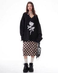 This Grunge Aesthetic black Sweater features a distressed black knit with a bold rose print and frayed hem details - boogzel clothing