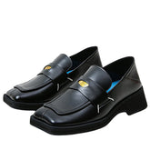The Futuristic Platform Loafers feature a sleek black design with a high platform sole - Boogzel Clothing