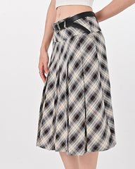This modern kilt skirt features a plaid pattern with a pleated structure. It has a knee-length cut and a structured waistband, offering a contemporary twist on a classic design - boogzel clothing - preppy aesthetic