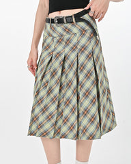 This modern kilt skirt features a plaid pattern with a pleated structure. It has a knee-length cut and a structured waistband, offering a contemporary twist on a classic design - boogzel clothing - preppy aesthetic