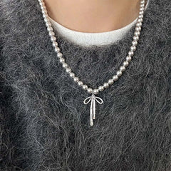 bow pendant pearl necklace boogzel clothing