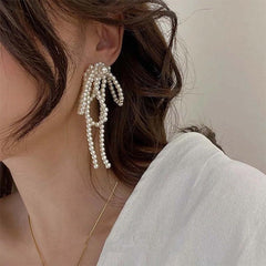 coquette bow pearl tassel earrings boogzel clothing