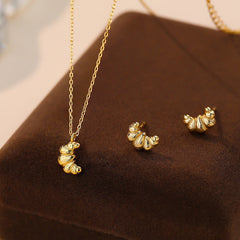 french croissant necklace boogzel clothing