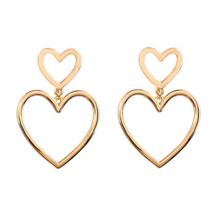 gold heart earrings boogzel clothing