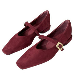 This aesthetic Mary Jane shoe featuring a square toe, low block heel, and soft suede-like surface. Designed with a slim strap and shiny gold buckle