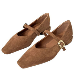 This aesthetic Mary Jane shoe featuring a square toe, low block heel, and soft suede-like surface. Designed with a slim strap and shiny gold buckle