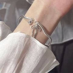 silver bow bracelet boogzel clothing
