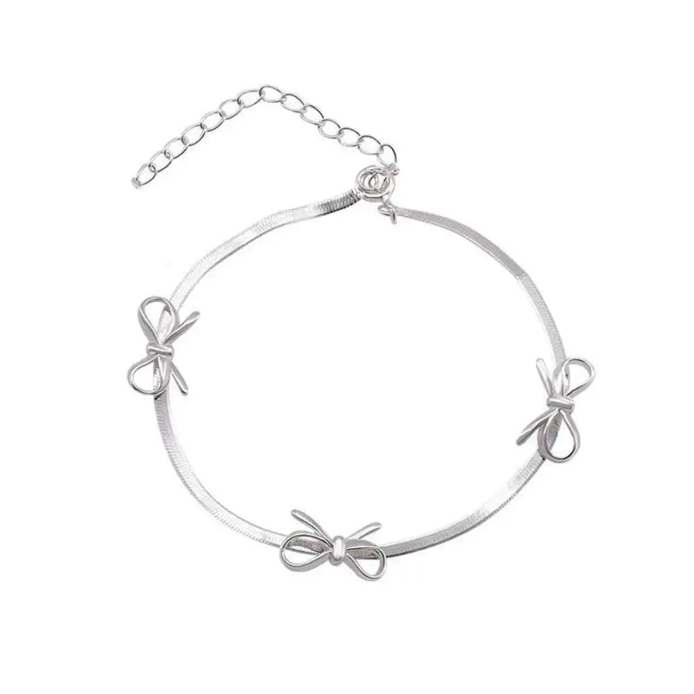 silver bows bracelet boogzel clothing