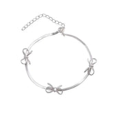 silver bows bracelet boogzel clothing