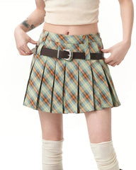 A stylish green preppy plaid pleated mini skirt featuring a high-waist design and loops for two belts. The skirt has a classic checkered pattern with a pleated structure, perfect for school outfits