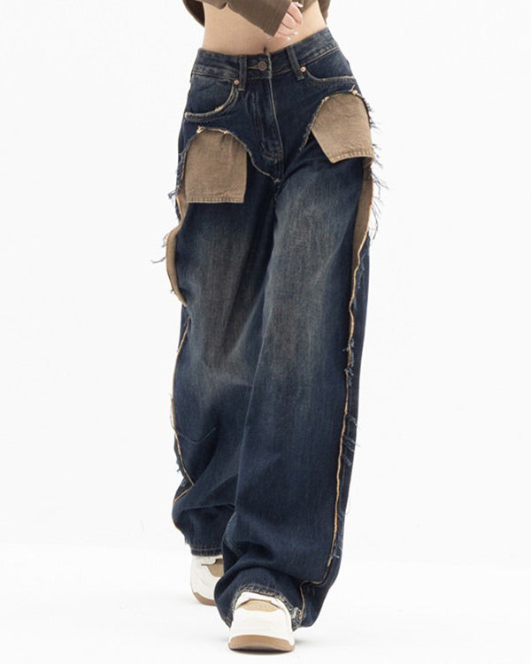 These Canyon Town Cowboy Jeans have a wide-leg cut, large contrasting front pockets, and frayed side details
