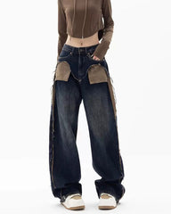 These Canyon Town Cowboy Jeans have a wide-leg cut, large contrasting front pockets, and frayed side details