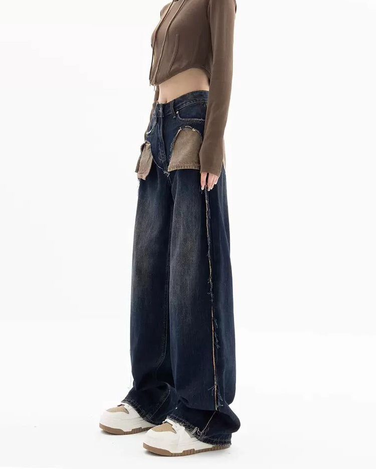 These Canyon Town Cowboy Jeans have a wide-leg cut, large contrasting front pockets, and frayed side details