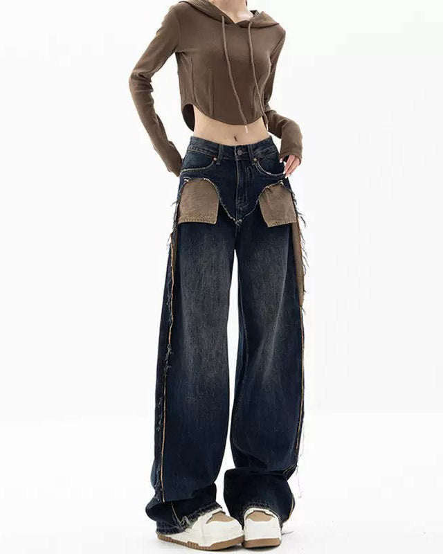 These Canyon Town Cowboy Jeans have a wide-leg cut, large contrasting front pockets, and frayed side details