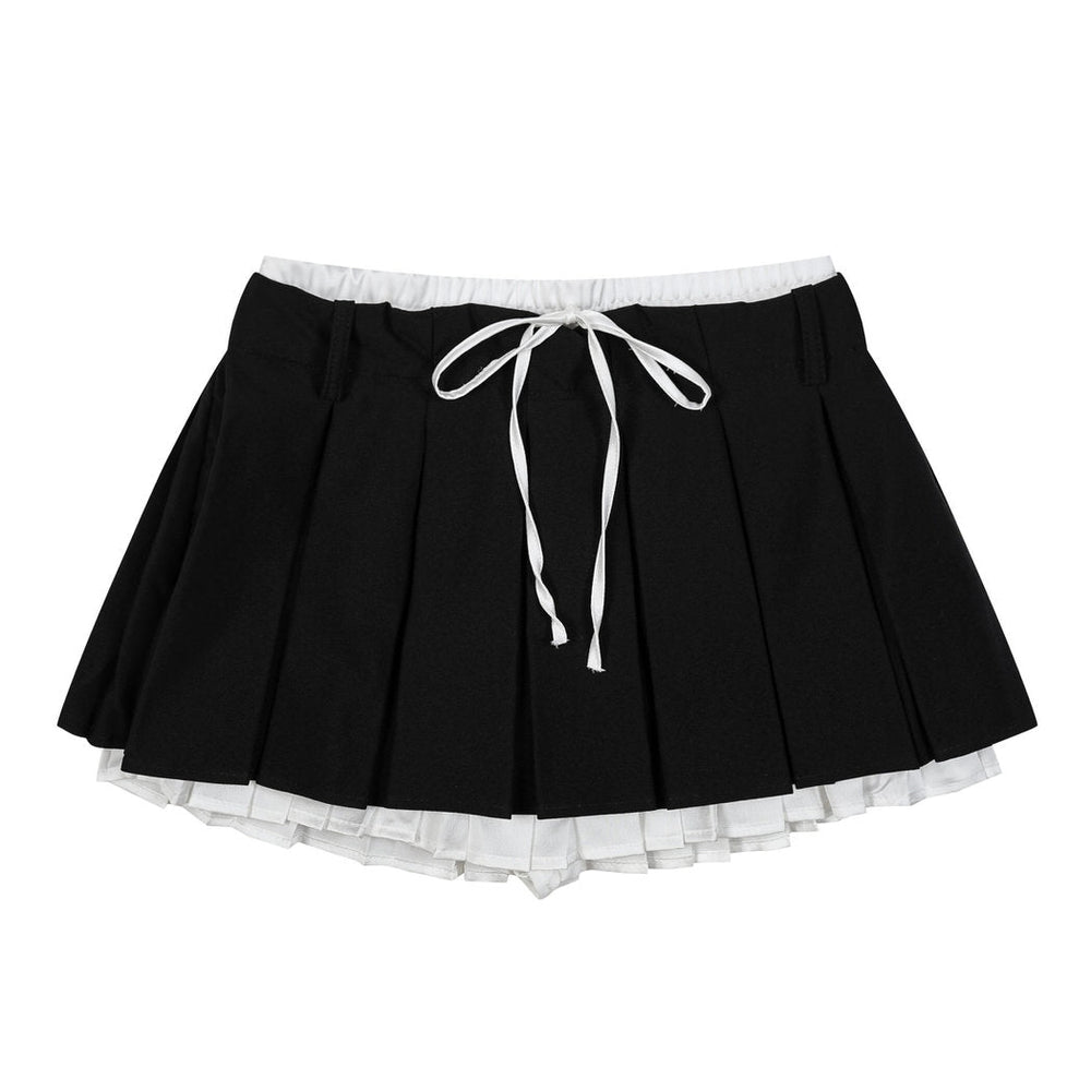 This layered preppy skirt features pleated detailing with a contrast lace underskirt. The ribbon waist and layered construction give it a playful, school-girl vibe- boogzel clothing