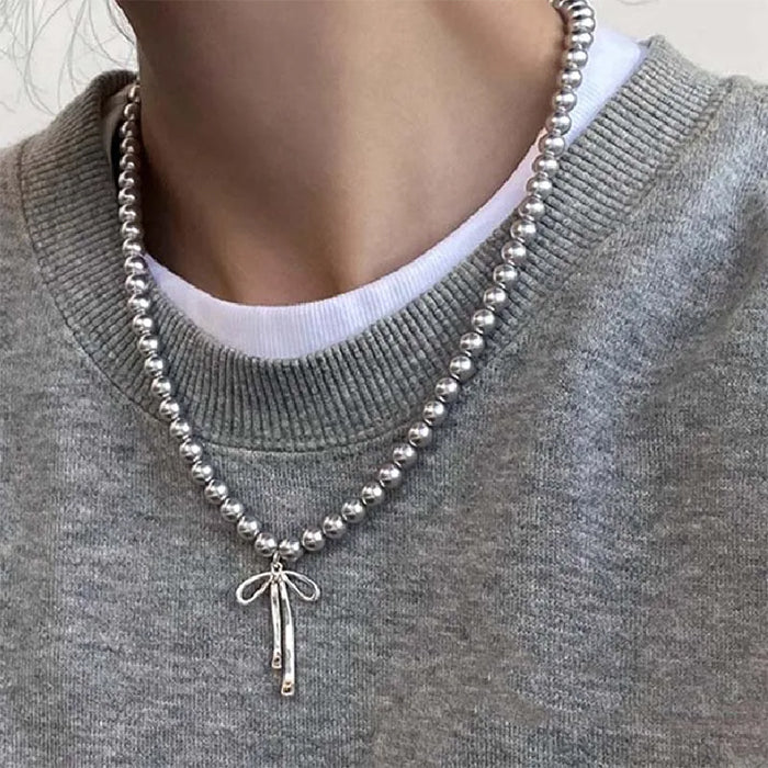 bow pendant pearl necklace boogzel clothing