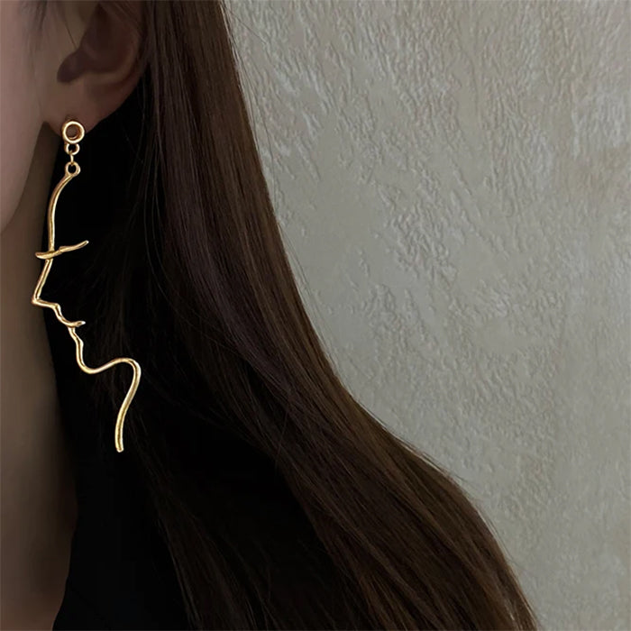 face outline earrings boogzel clothing