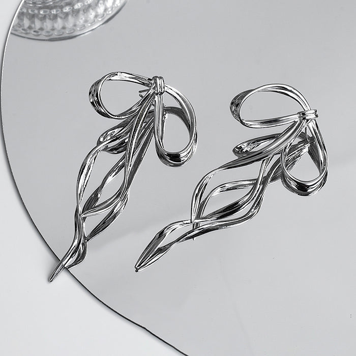 silver bow earrings boogzel clothing