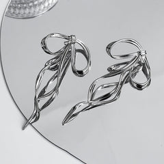 silver bow earrings boogzel clothing