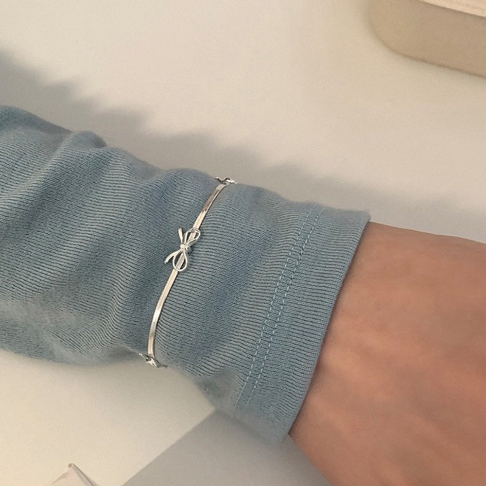 silver bows bracelet boogzel clothing
