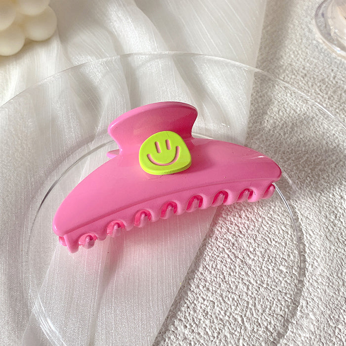 smiley face hair claw boogzel clothing
