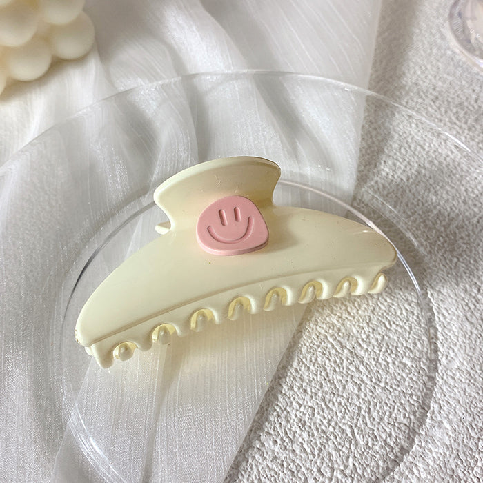smiley face hair claw boogzel clothing
