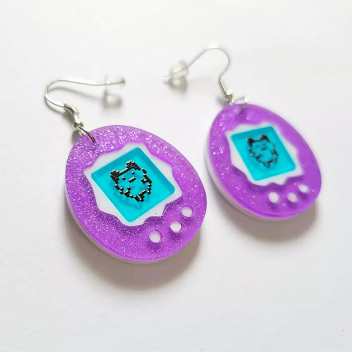 tamagotchi shaped earrings boogzel clothing